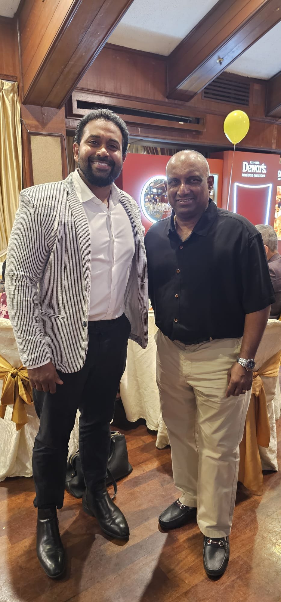 Gihan Ekanayake with a guest at a community event