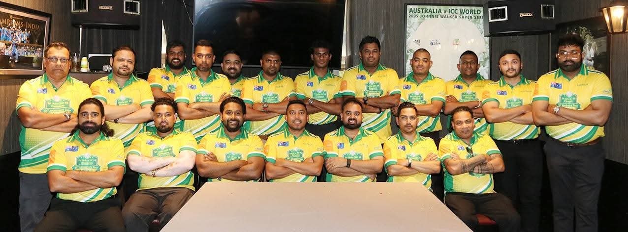 Cricket team portrait in yellow and green uniforms